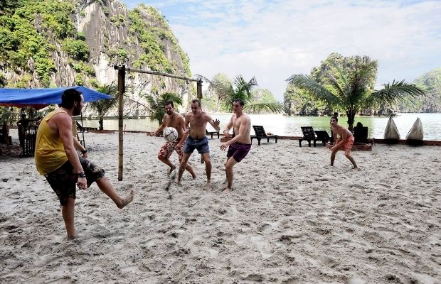 Playing sport games on the beach